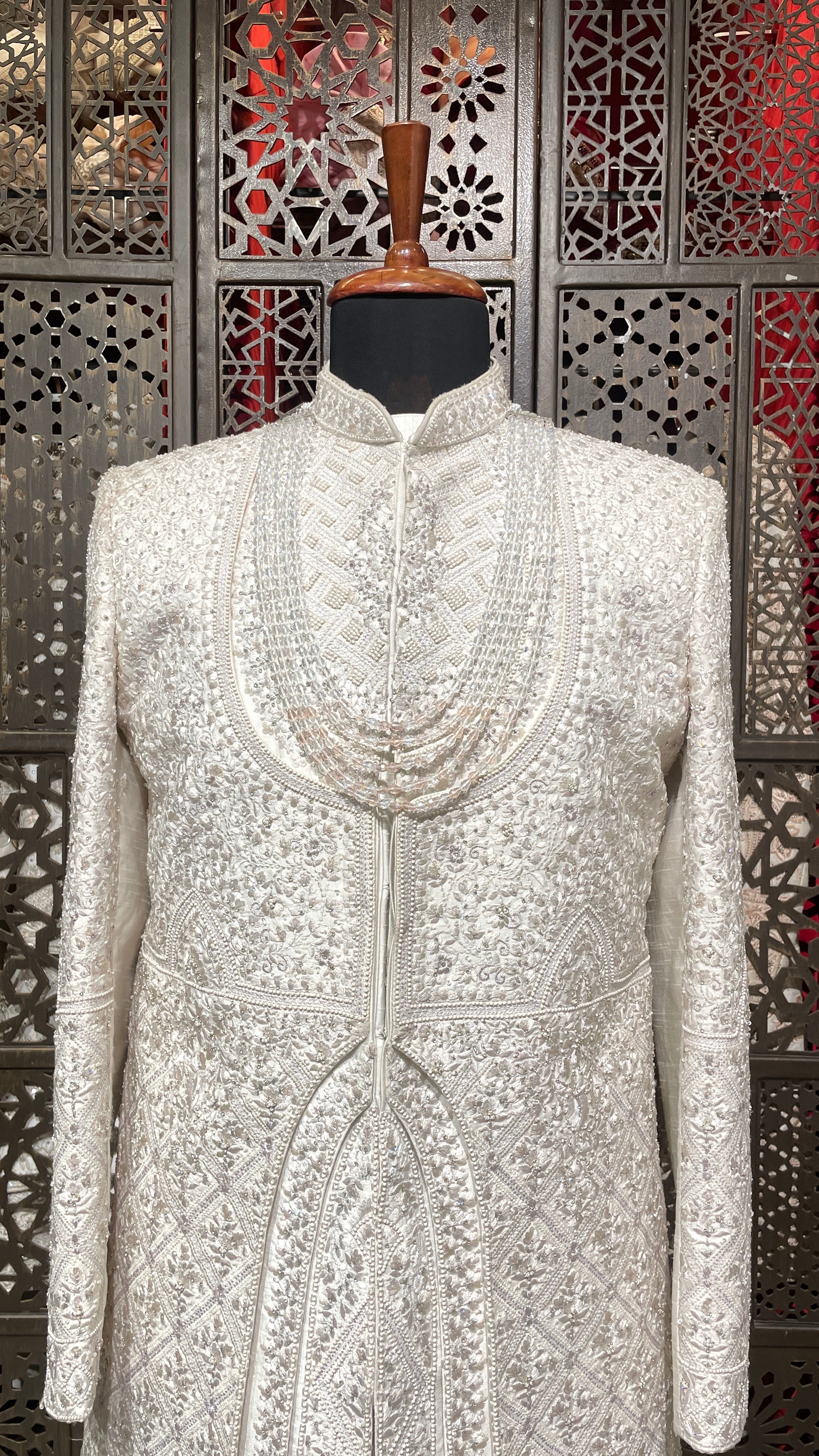 Ivory layered sherwani with threadwork and embellishment
