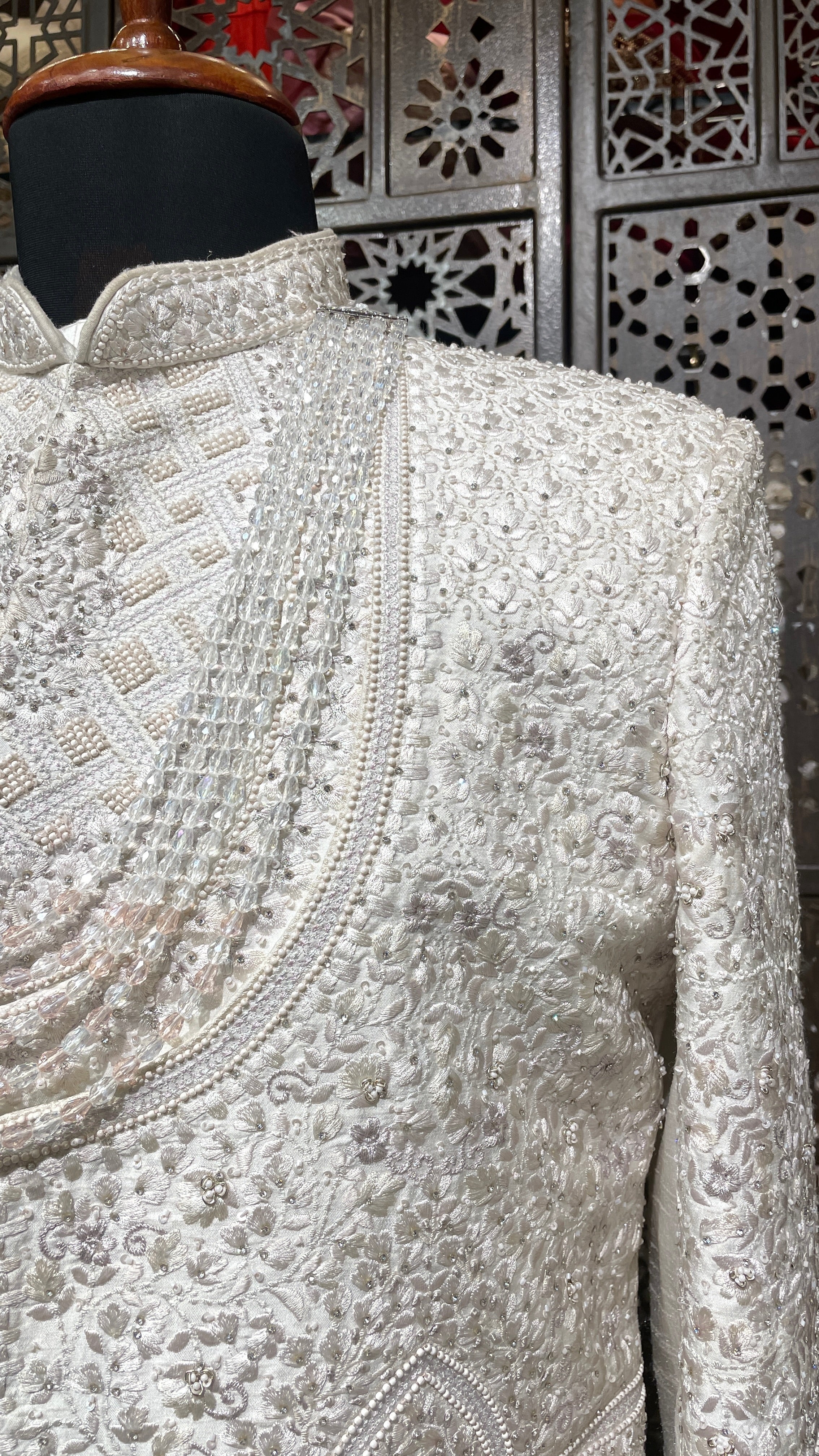 Ivory layered sherwani with threadwork and embellishment