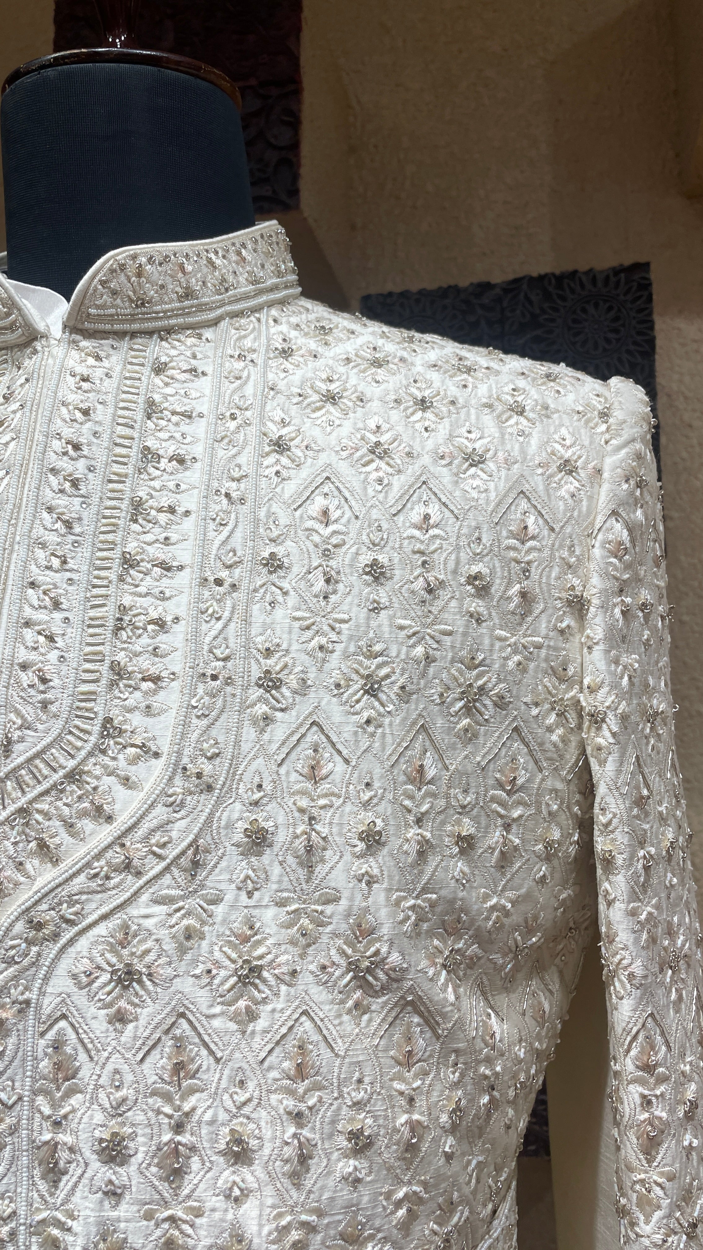 Cream silk layered sherwani with embellishments