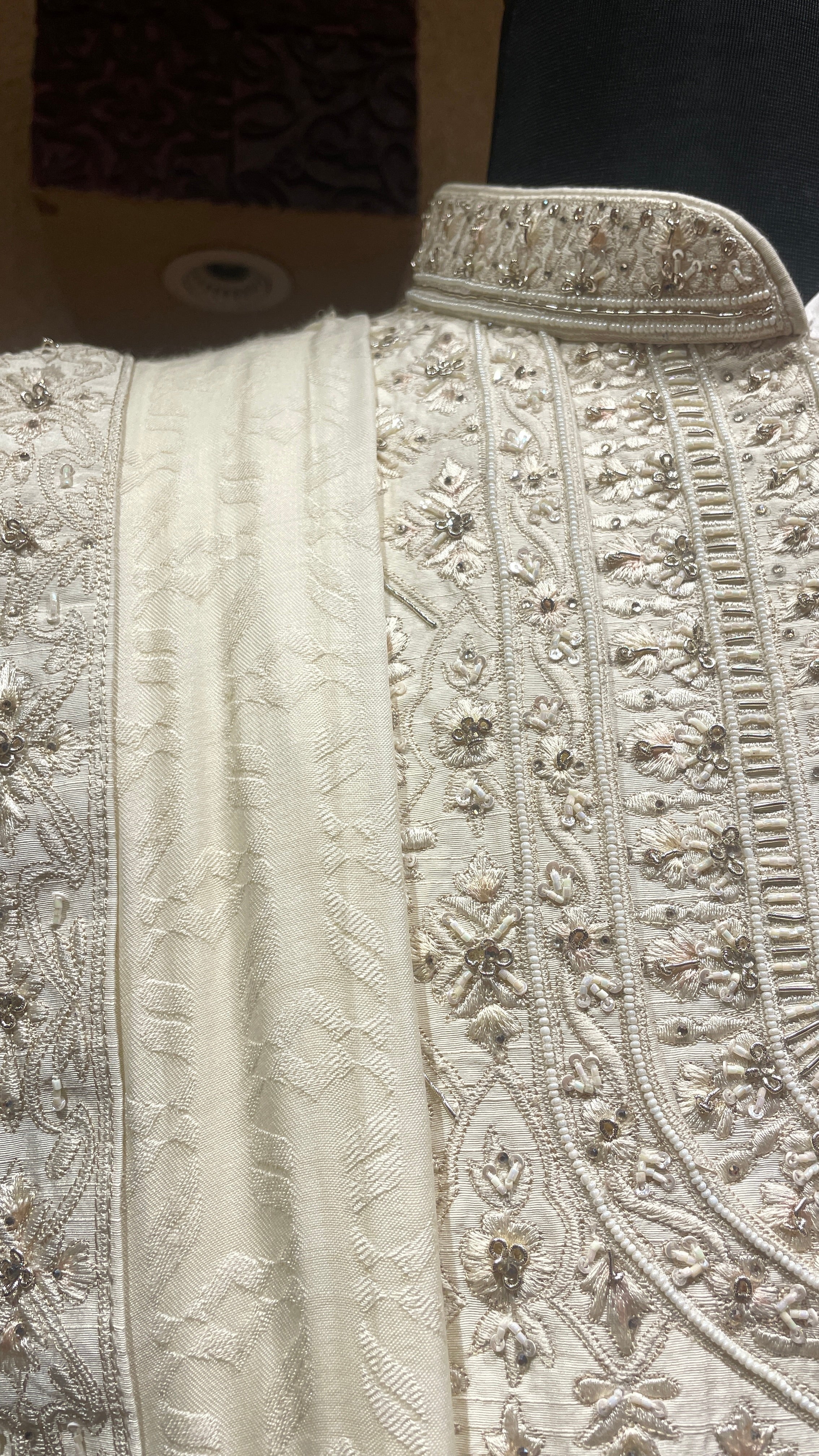 Cream silk layered sherwani with embellishments