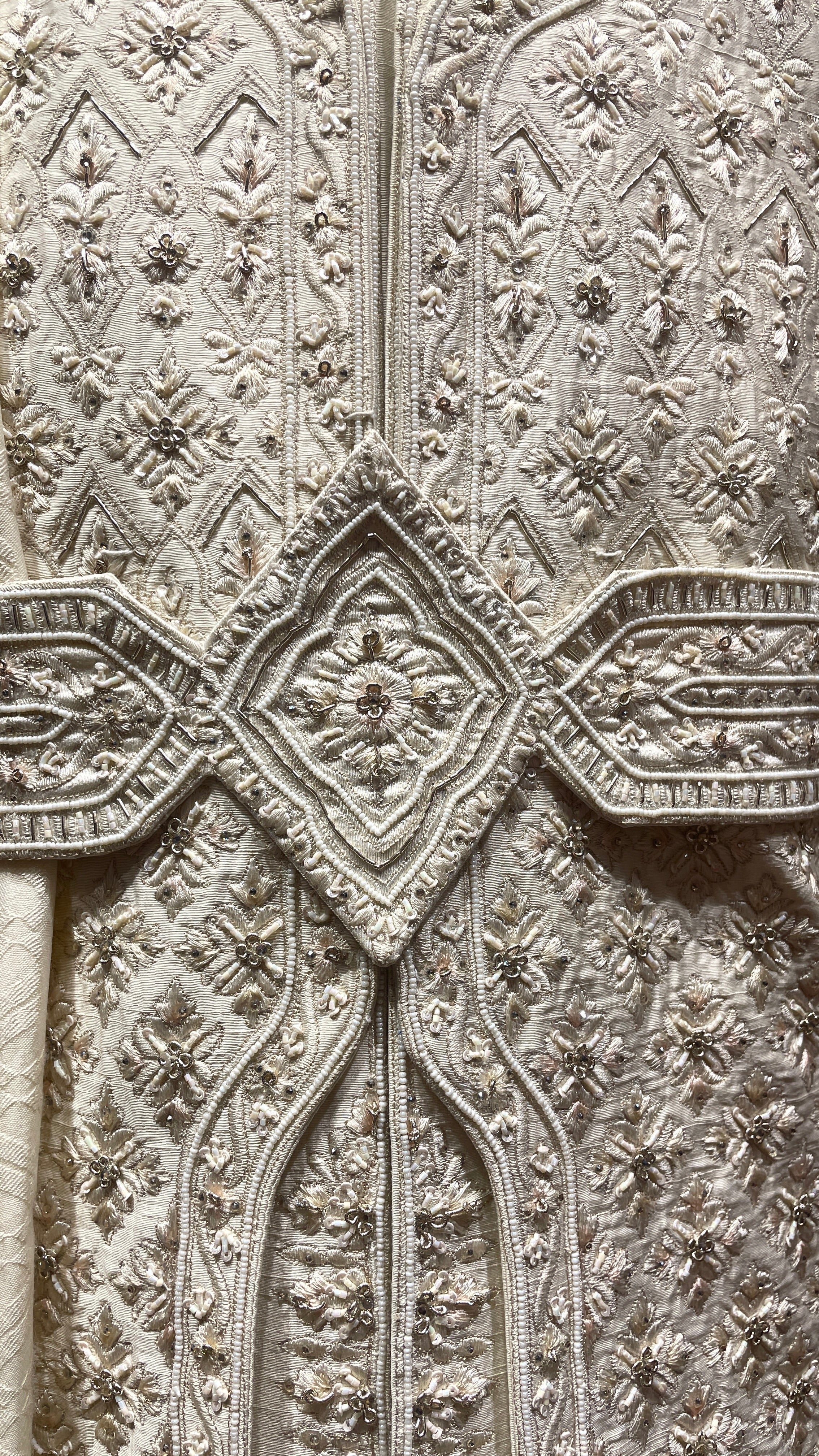 Cream silk layered sherwani with embellishments