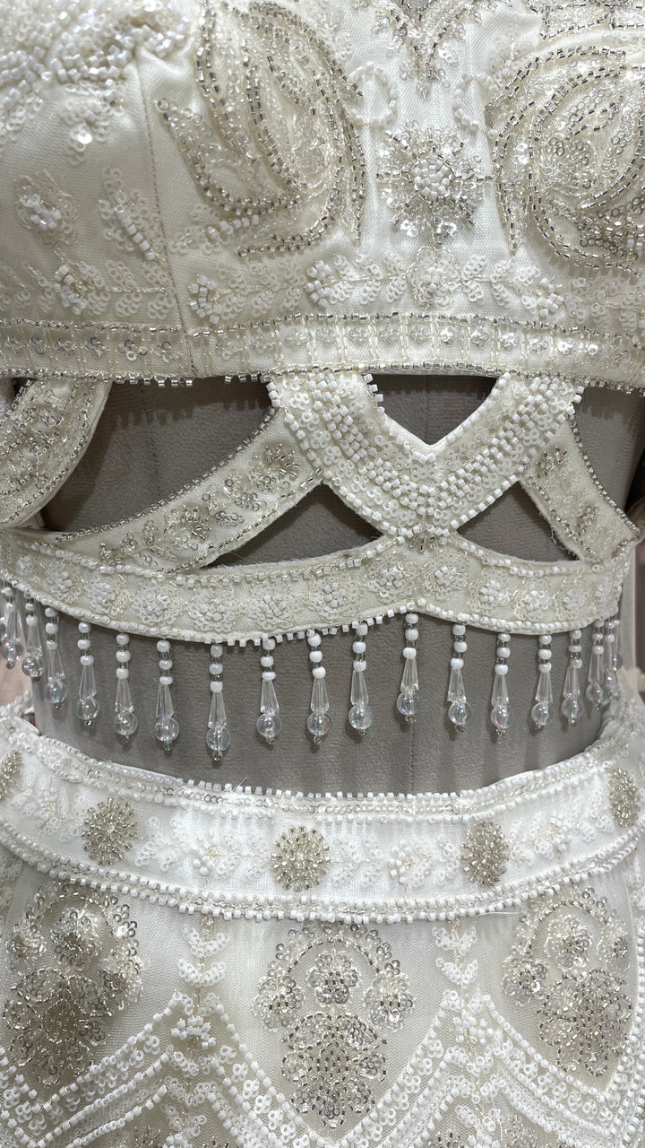 Ivory Net lehenga with sequins cutdana and pot embellishments