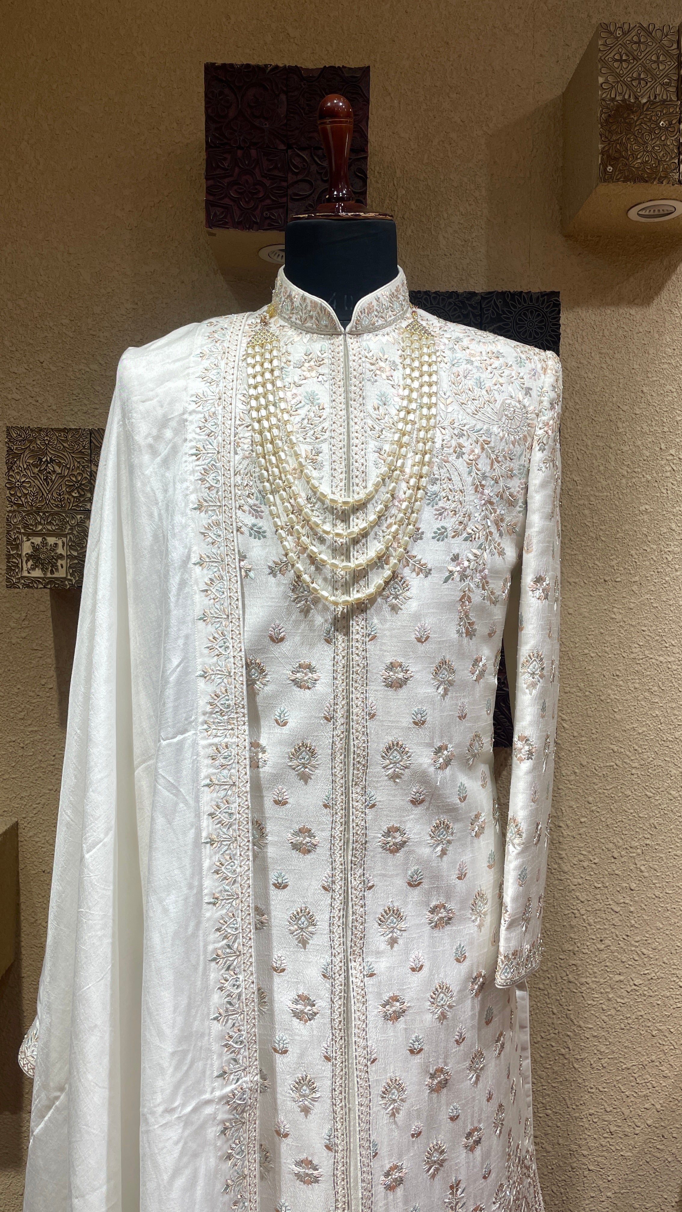 Ivory silk sherwani with floral motifs