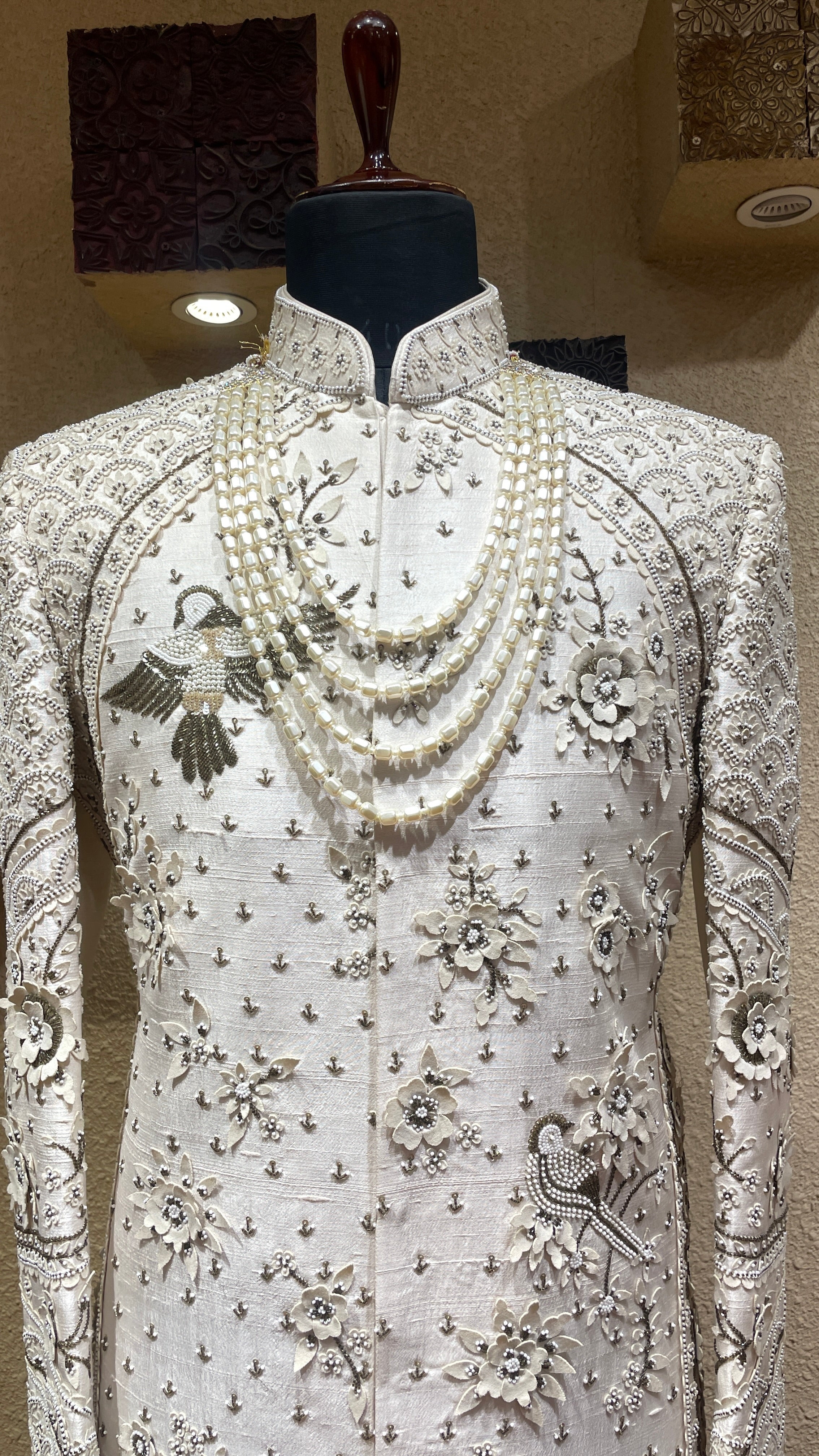 Gold silk sherwani with motifs and cutdana embellishments