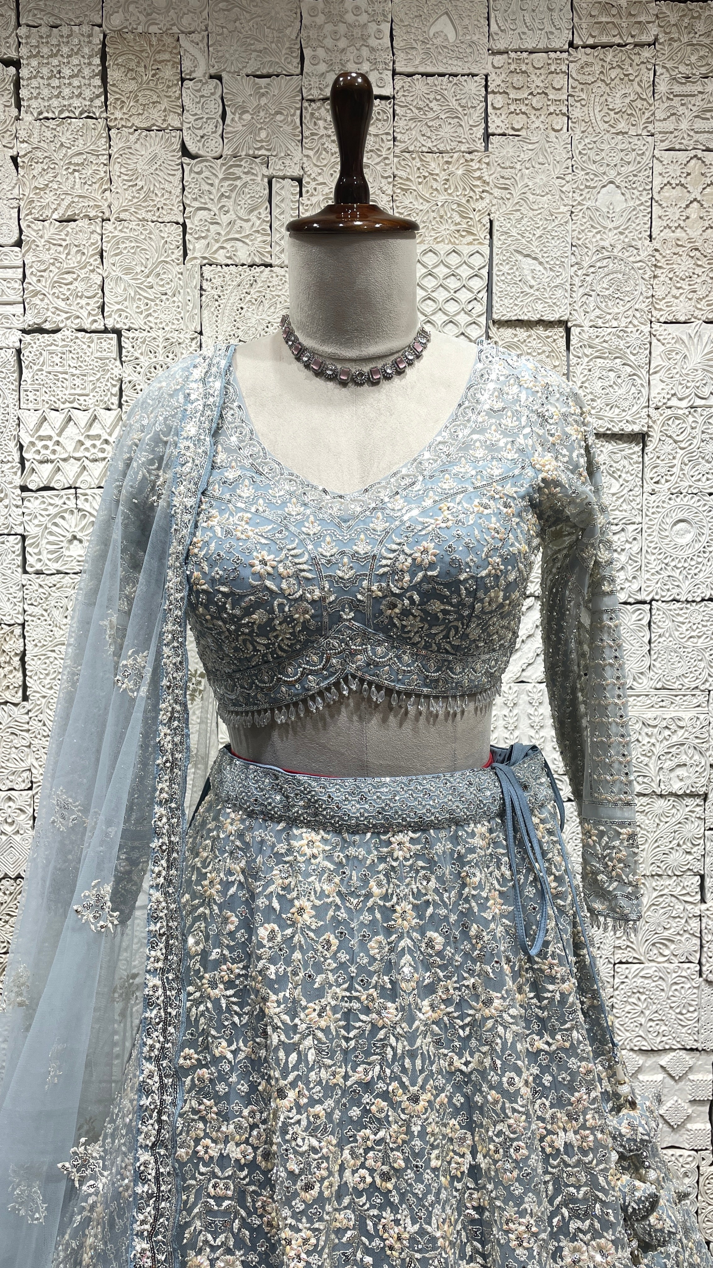 Pastel blue net lehenga with pearl and sequins embellishments