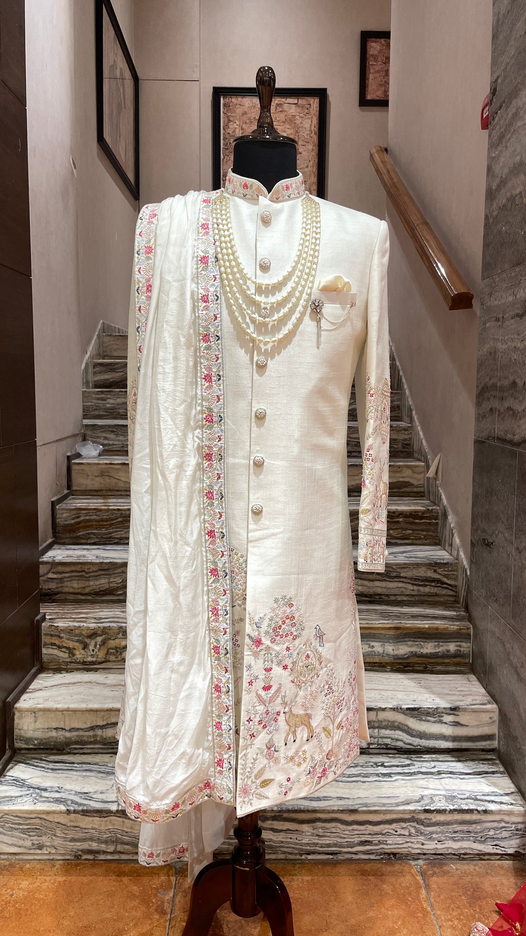 Ivory sherwani with Animal and floral details