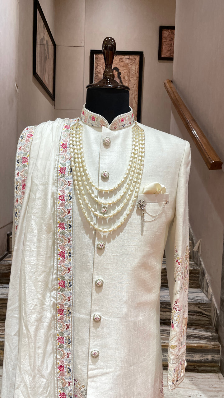 Ivory sherwani with Animal and floral details