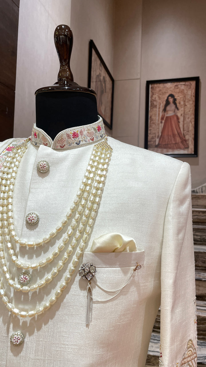 Ivory sherwani with Animal and floral details