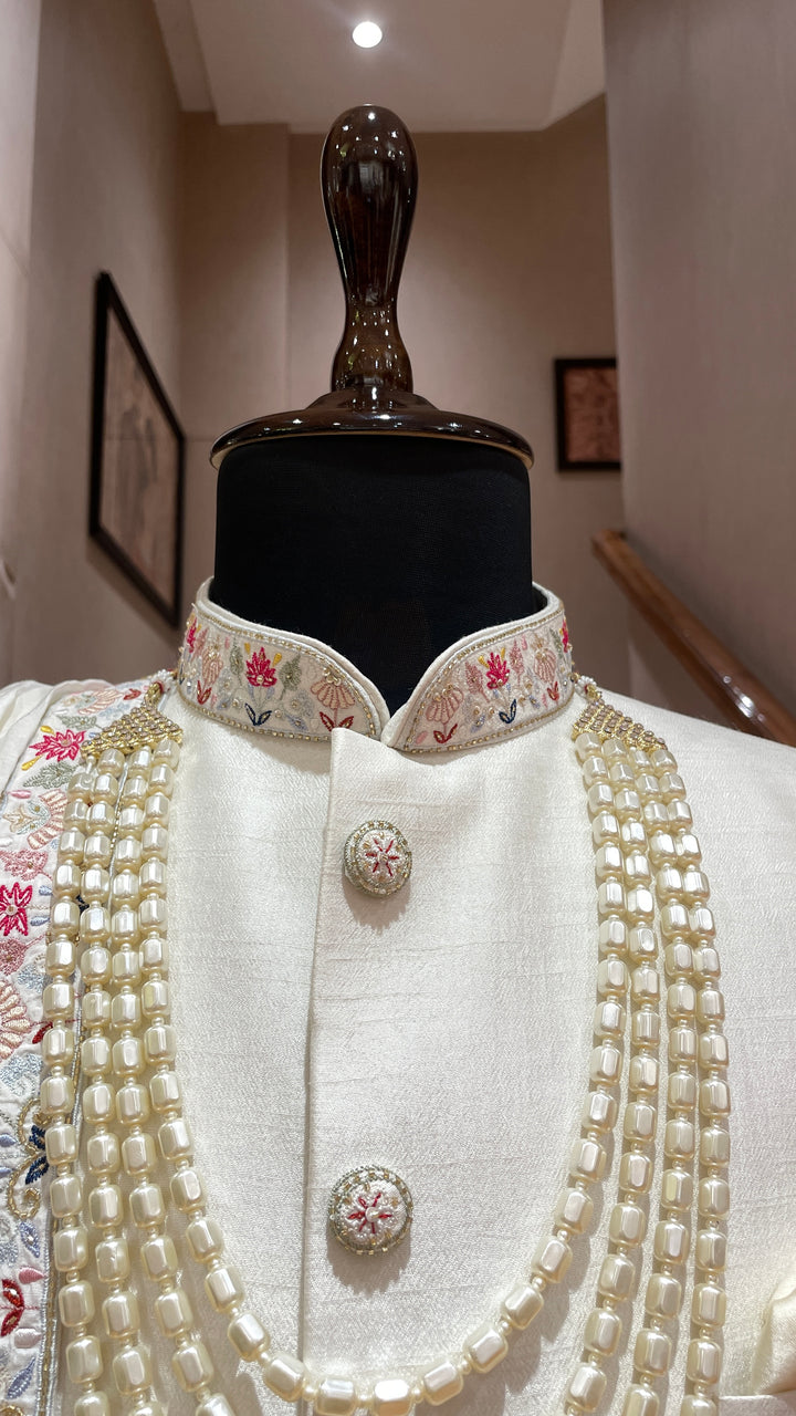 Ivory sherwani with Animal and floral details