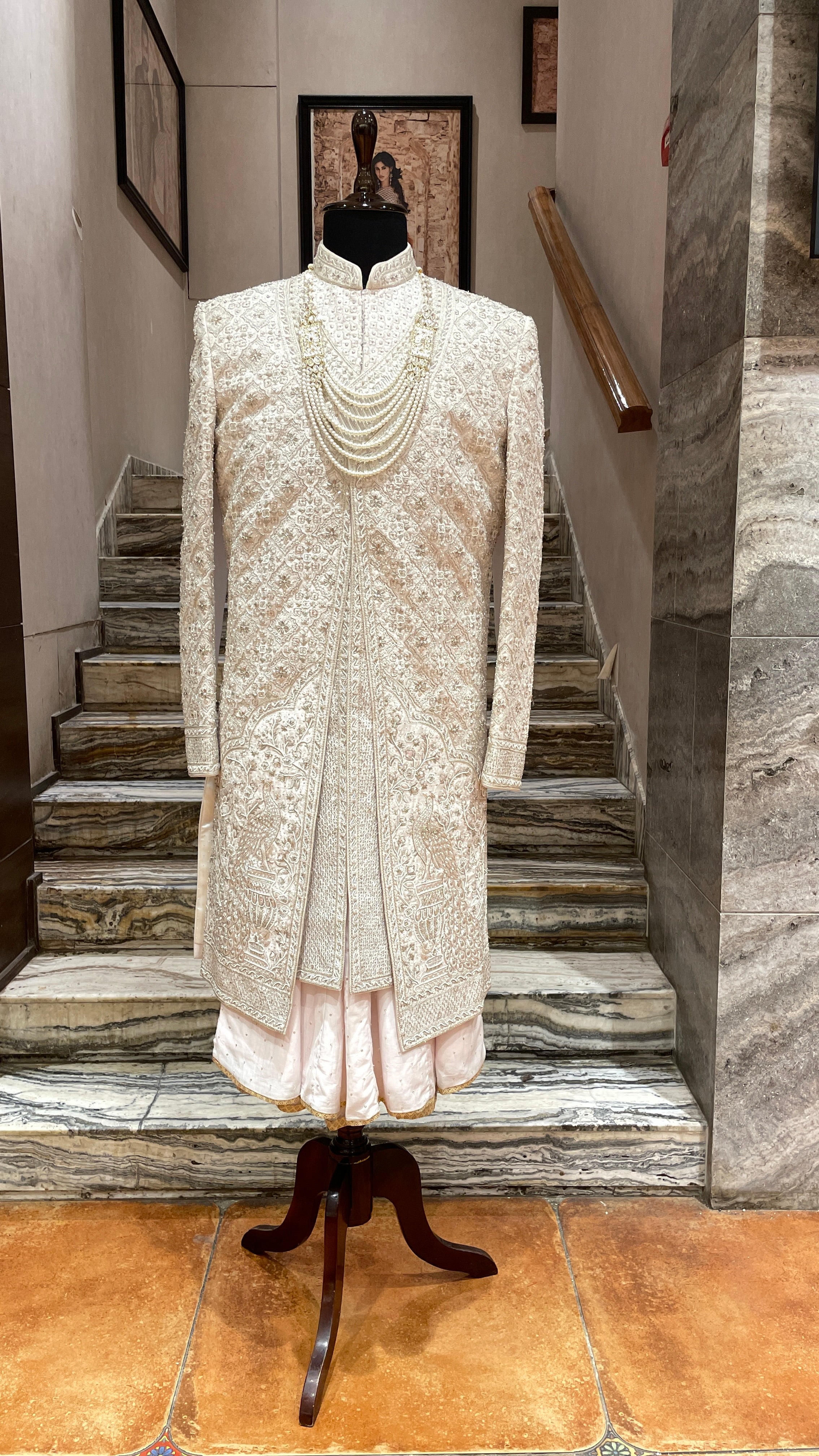 Cream silk Sherwani with gold & silver embellishments