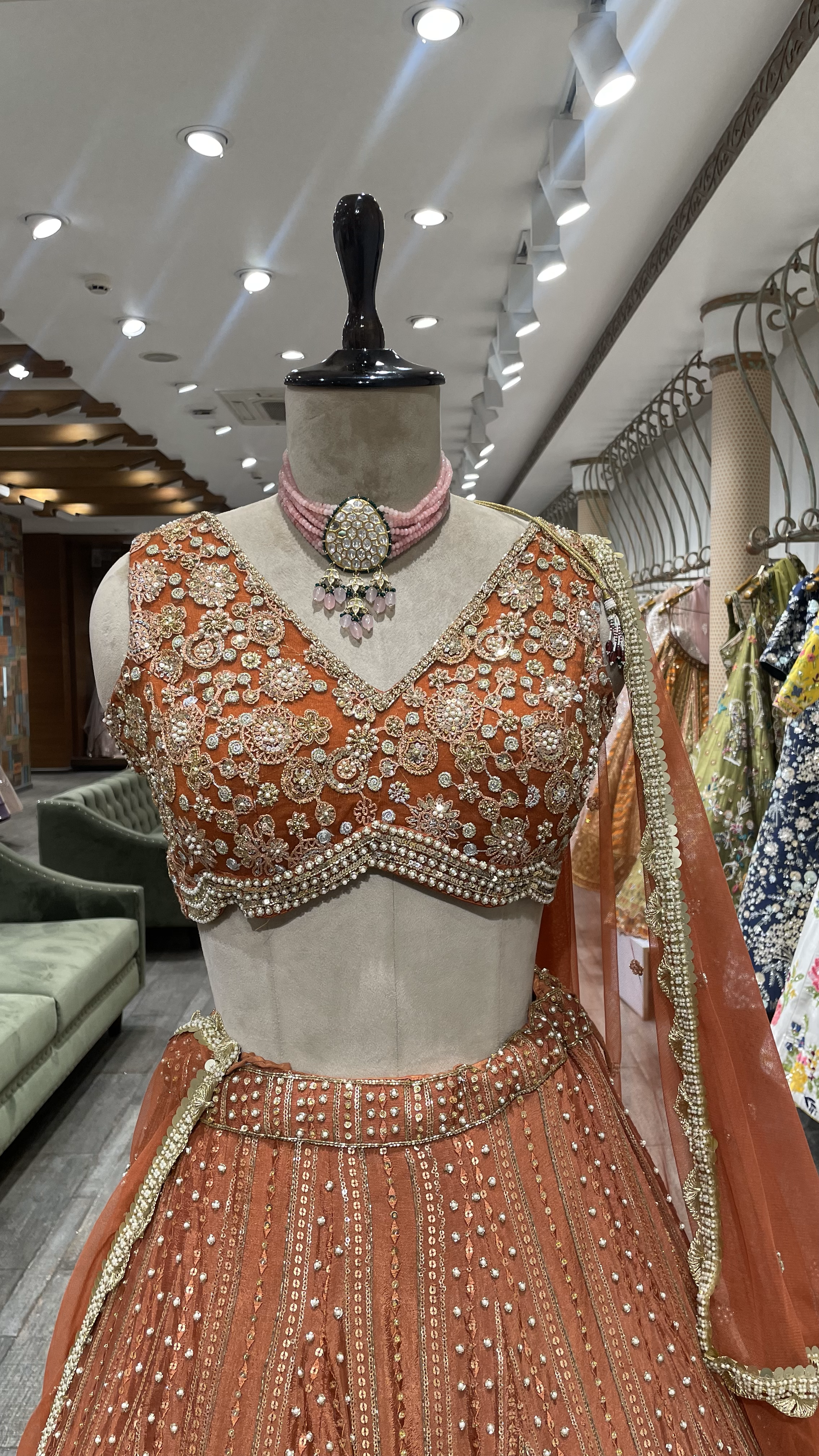 Rust Chinon Lehenga with pearl sequins and pot embellishments