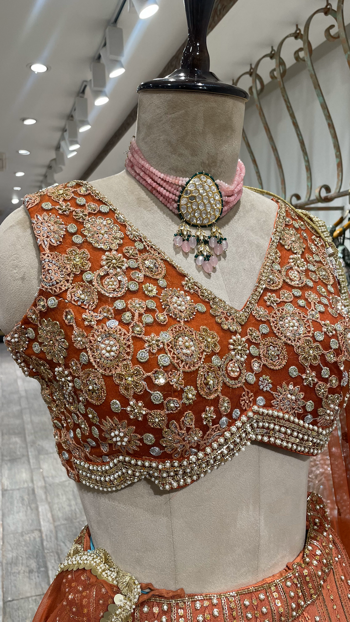 Rust Chinon Lehenga with pearl sequins and pot embellishments