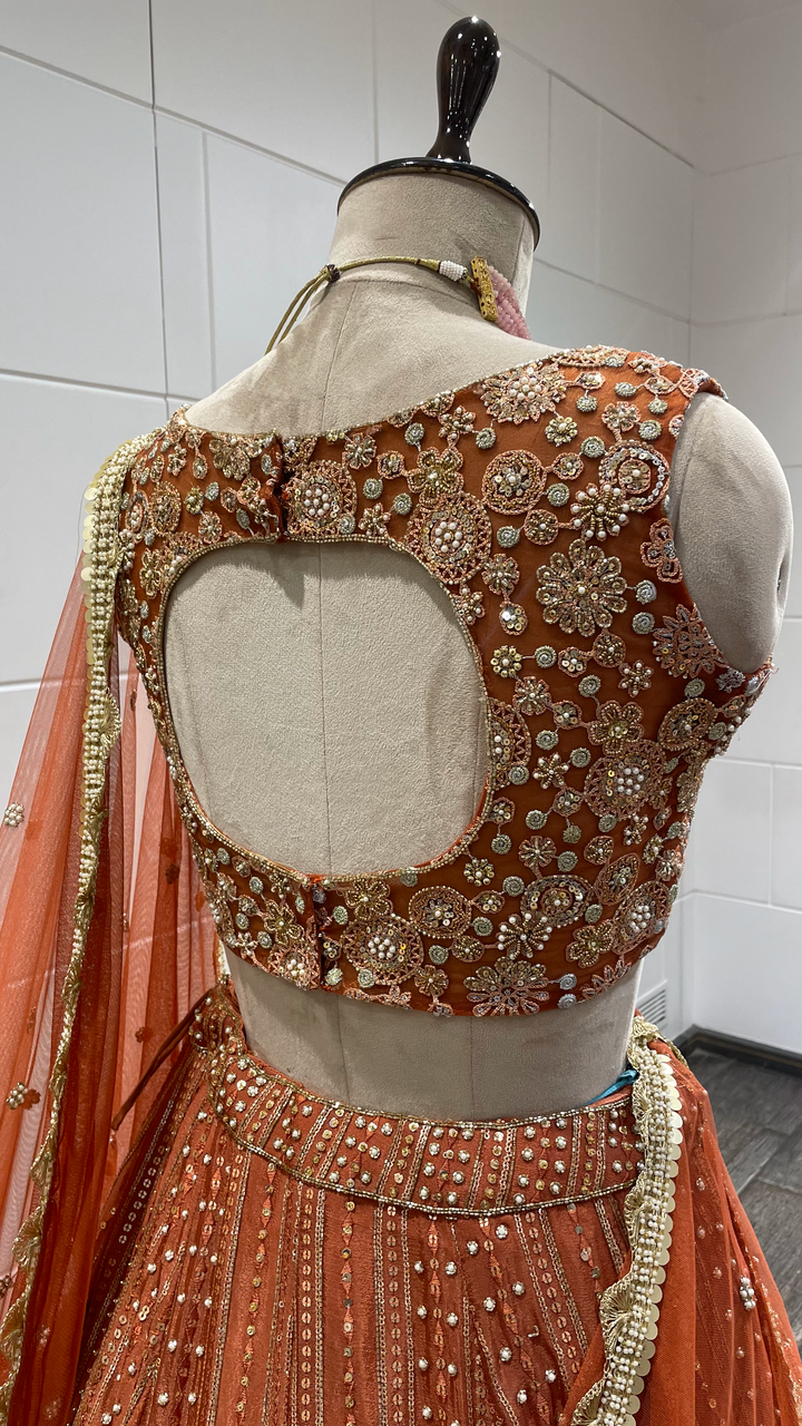 Rust Chinon Lehenga with pearl sequins and pot embellishments