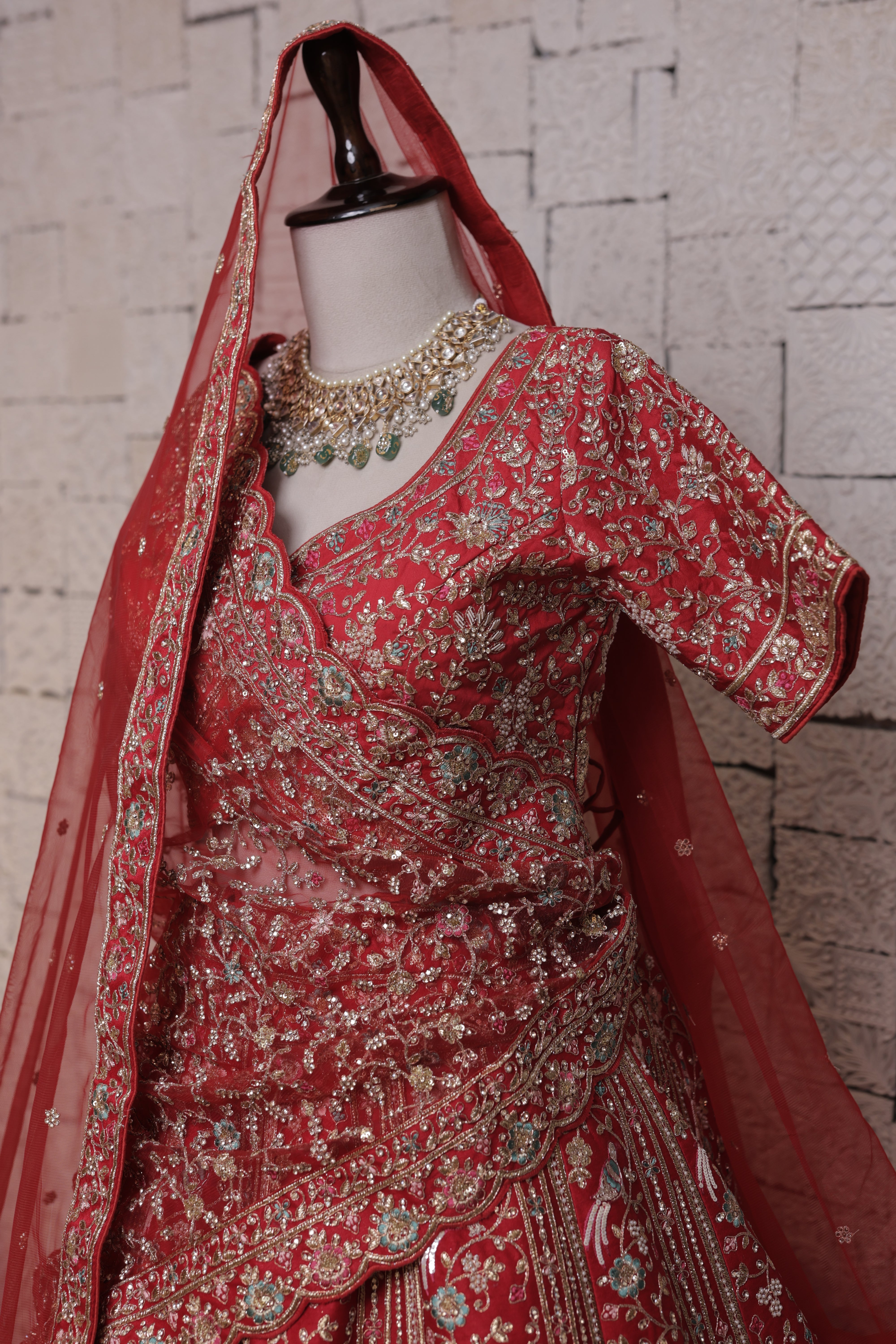 Red bridal lehenga with Doli mor embroidery design