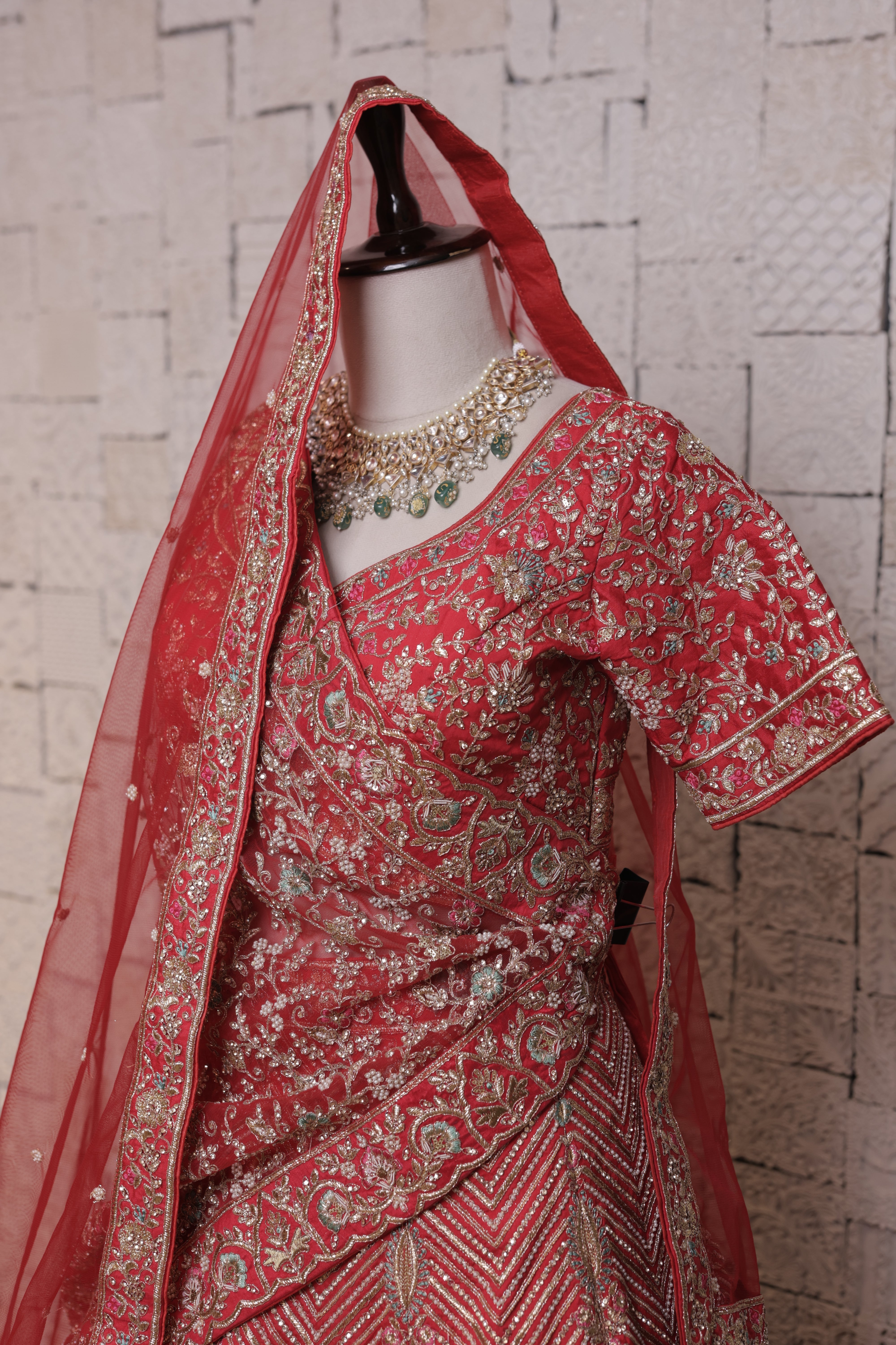 Red bridal lehenga with Urn & peacock embroidery design