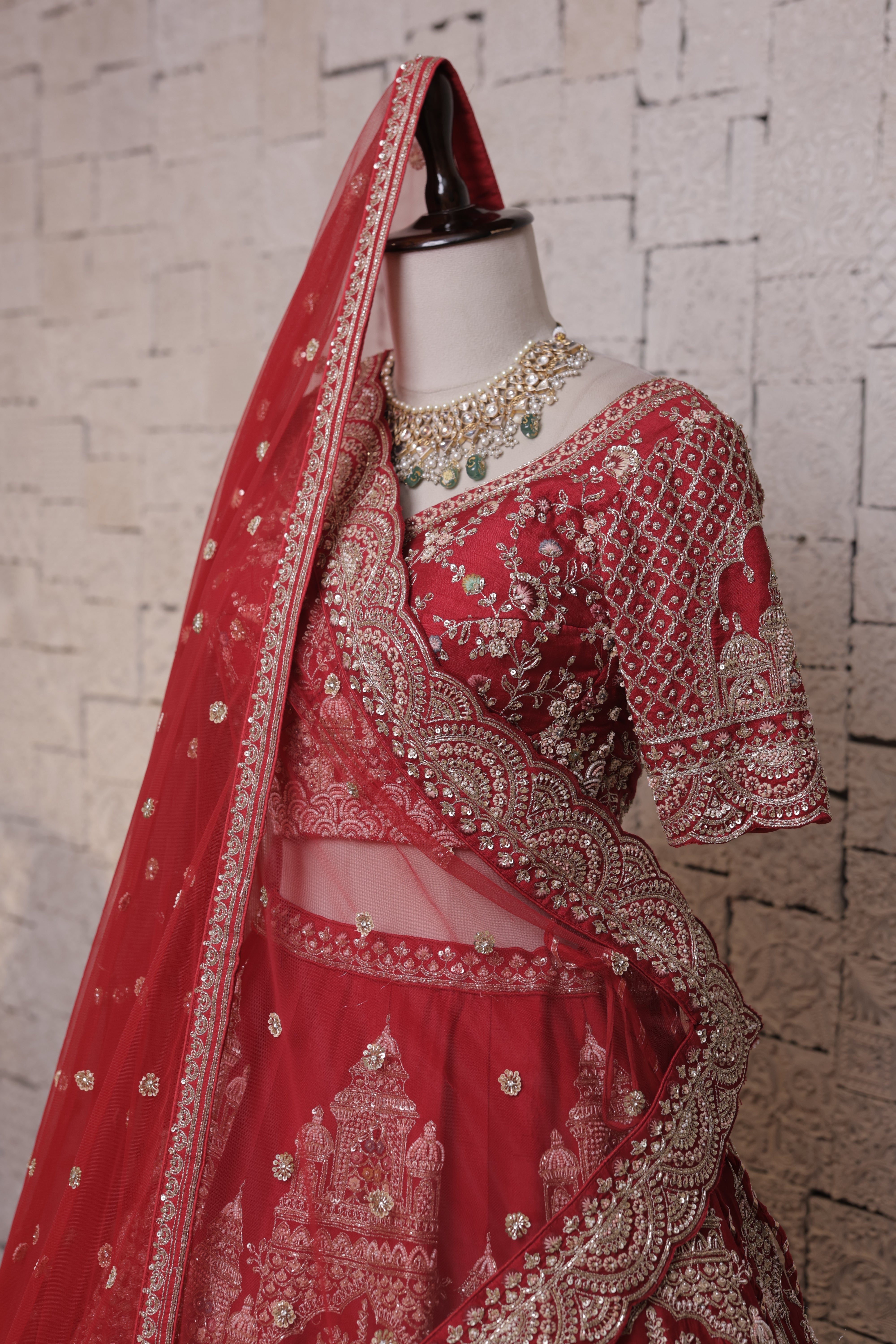 Red Multilayered Bridal Lehenga with Temple Embroidery