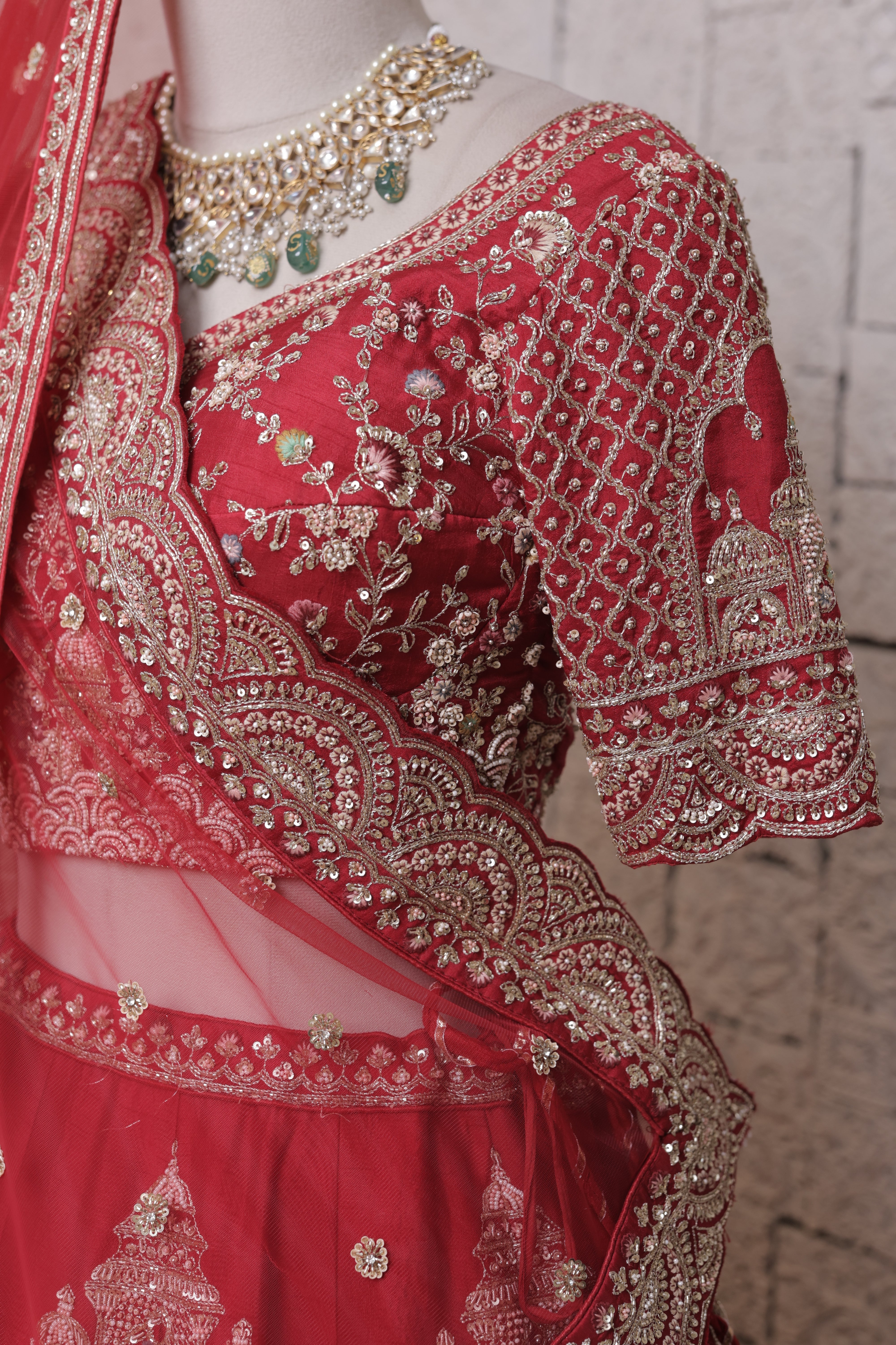 Red Multilayered Bridal Lehenga with Temple Embroidery