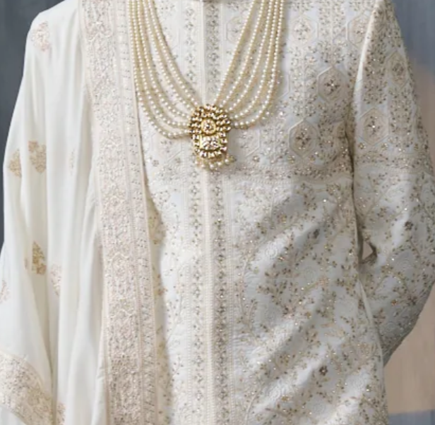 Ivory silk sherwani set with golden embellishments (accessories included)
