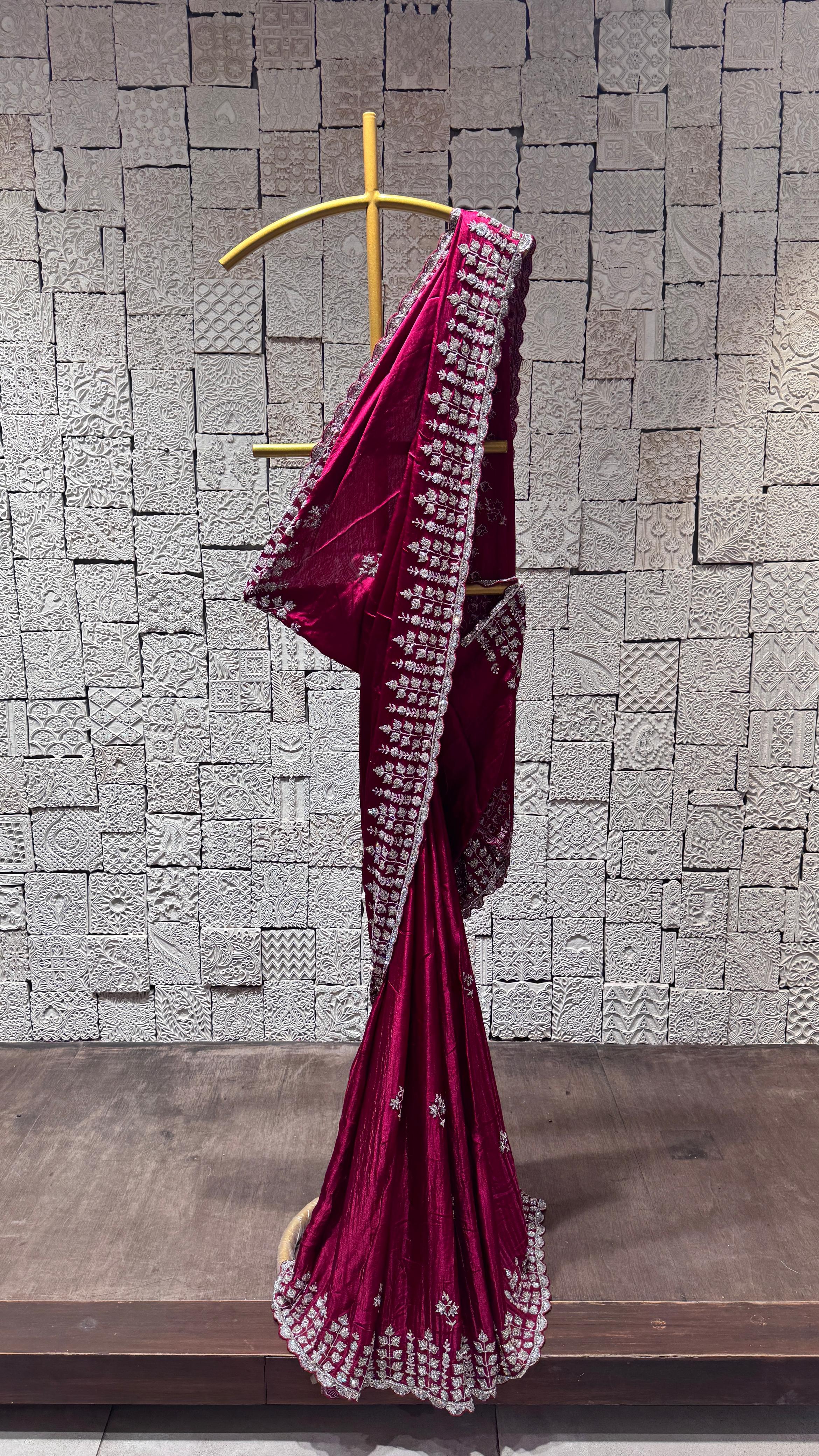 Deep pink saree with heavy floral border
