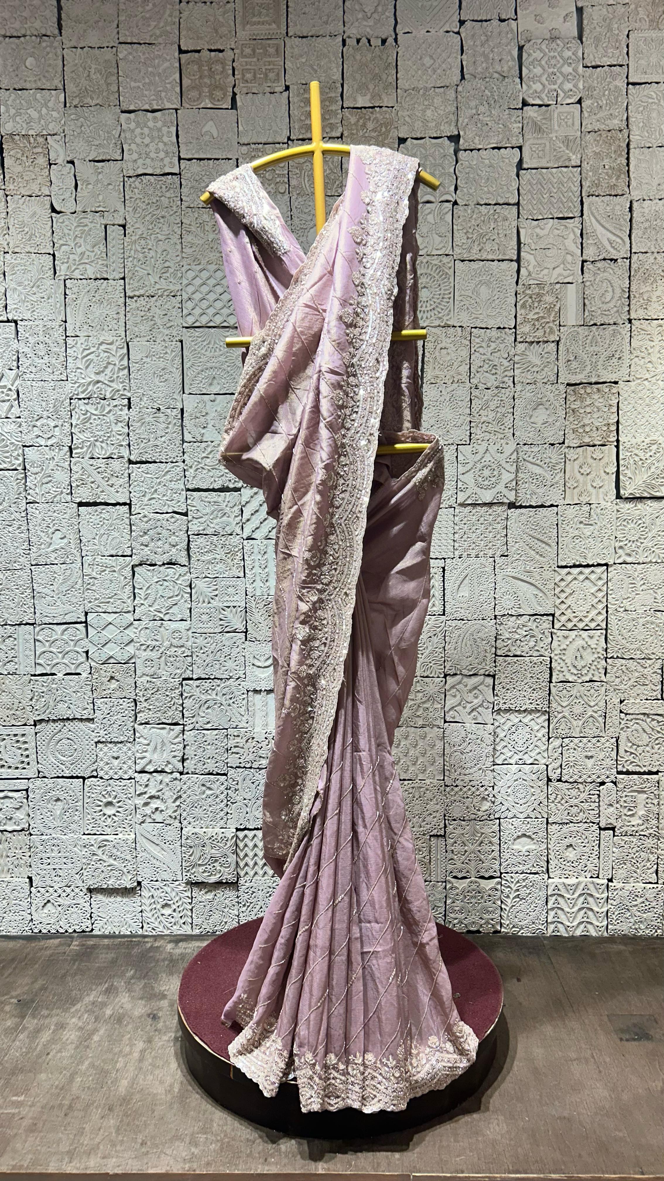 Onion color saree with heavy floral border