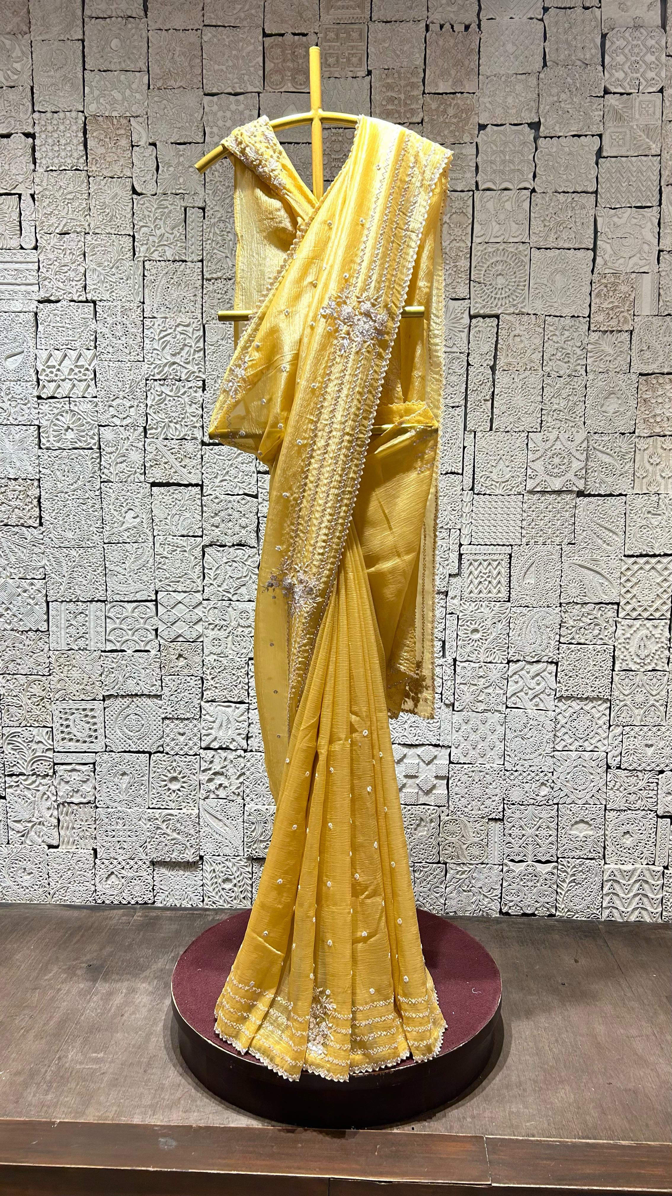 Yellow saree with simple zig-zag border