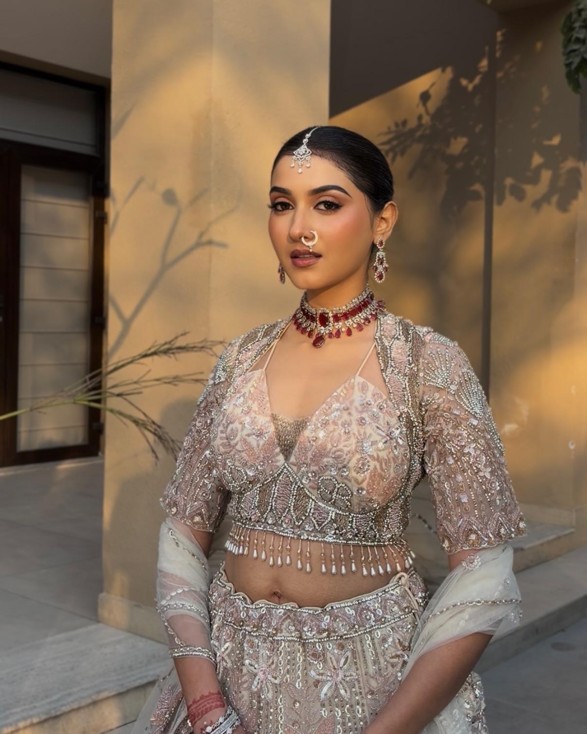 Pink & cream net lehenga with Floral embellishments