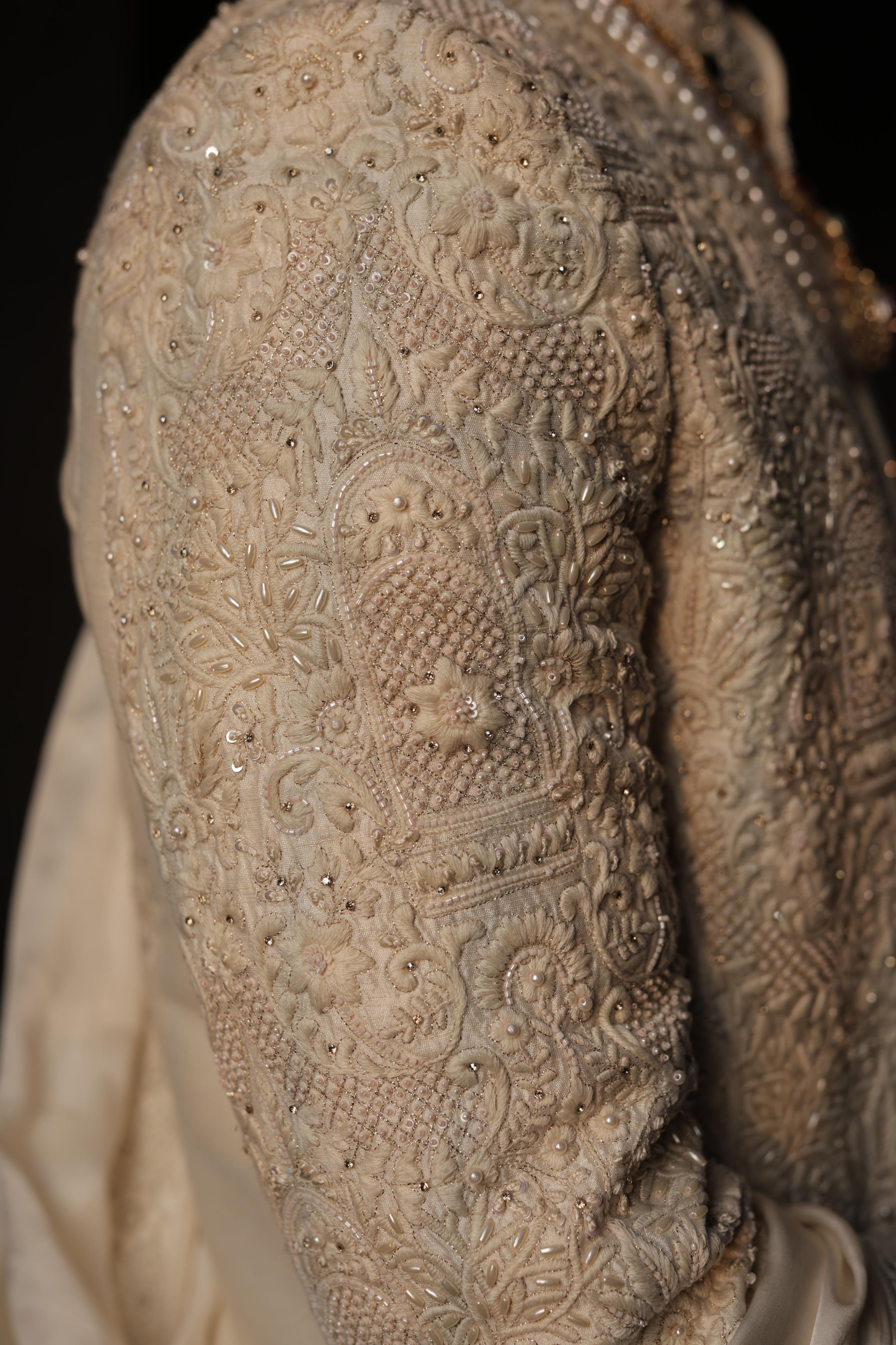 Ivory silk sherwani with intricate embroidery