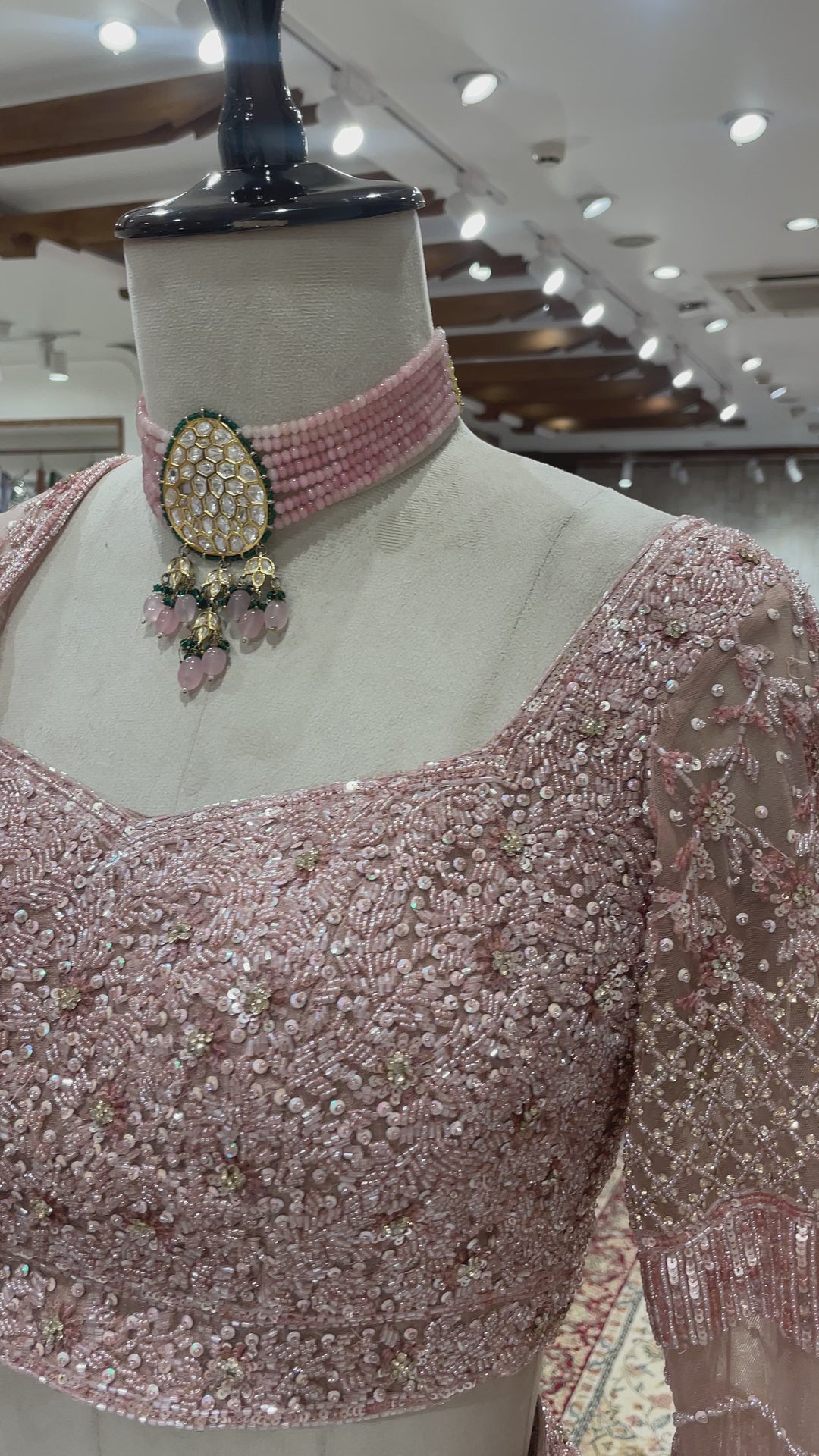 Pastel pink net lehenga with sequins pot and cutdana embroidery