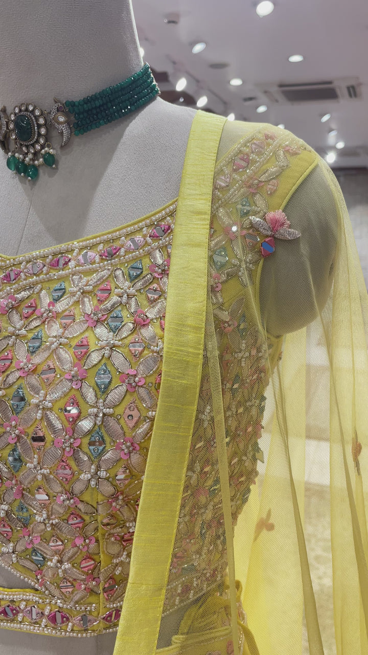 Yellow Georgette lehenga with floral motifs