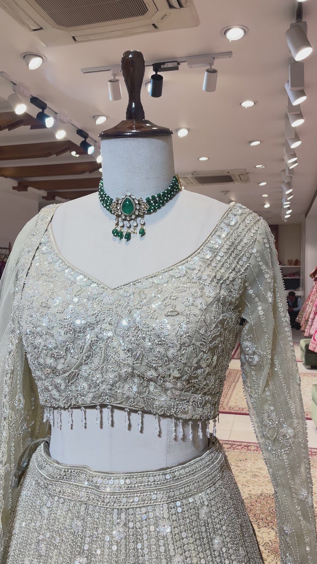 Cream net lehenga with cutdana and floral motifs