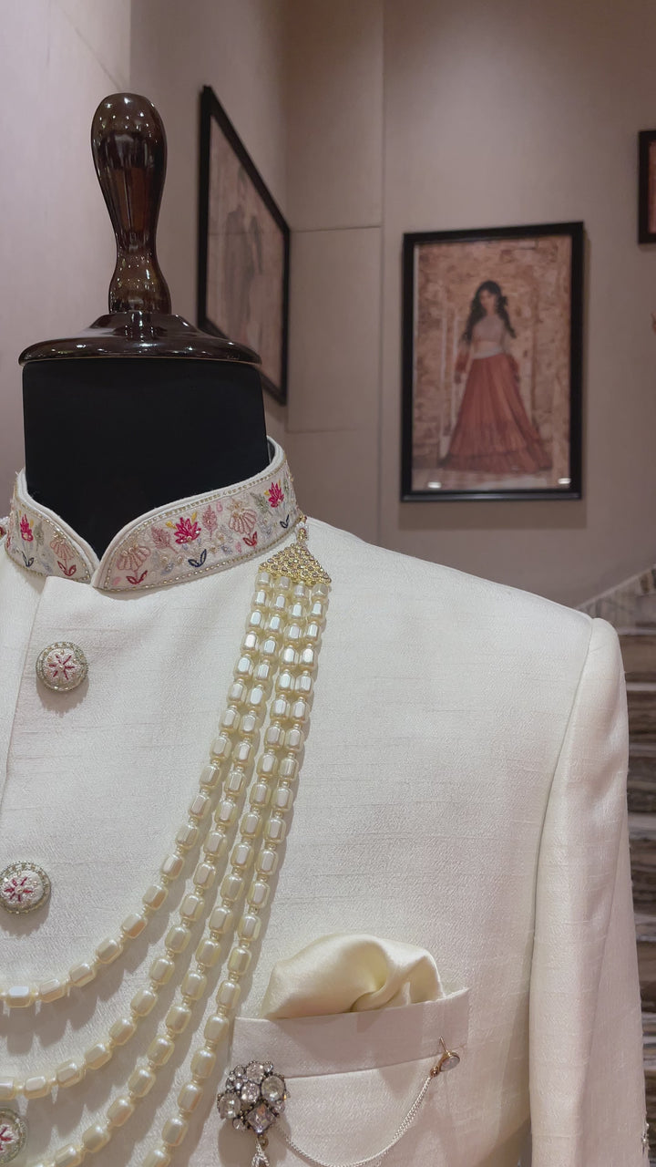 Ivory sherwani with Animal and floral details