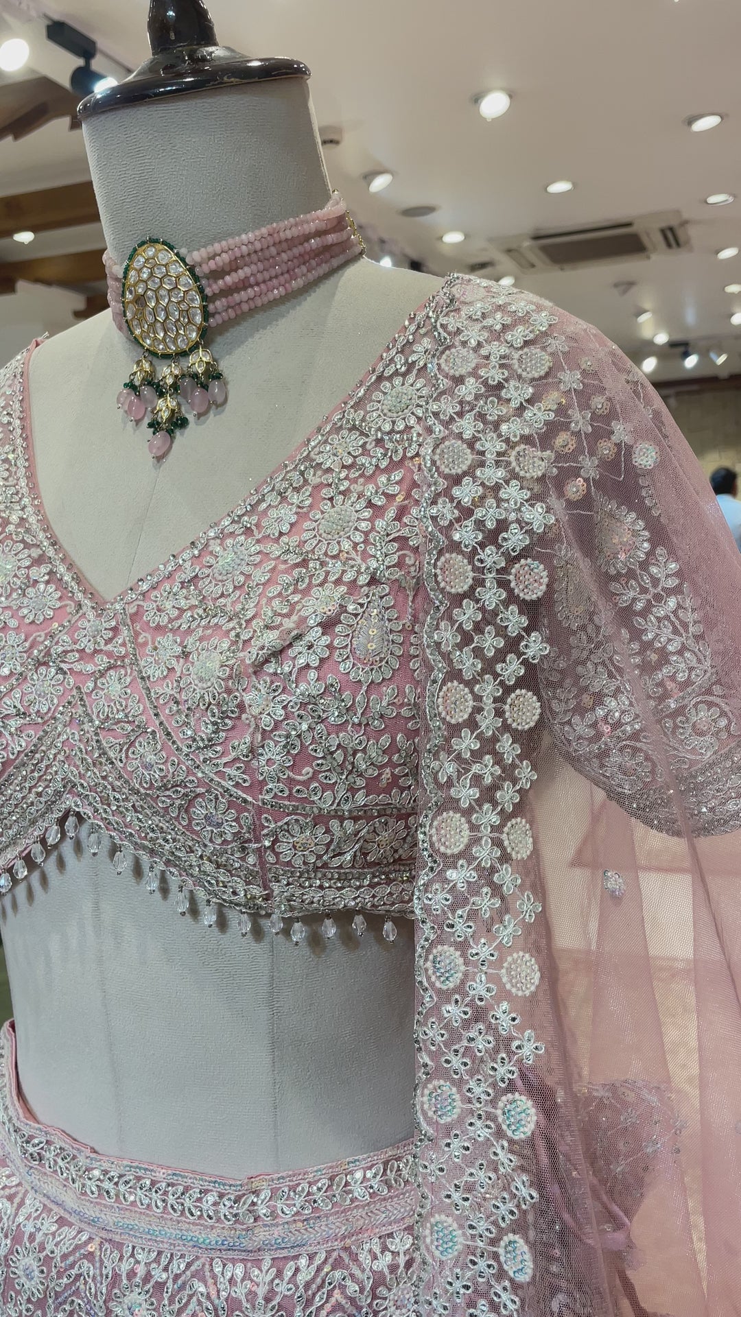 Pastel pink net lehenga with sequins and threadwork