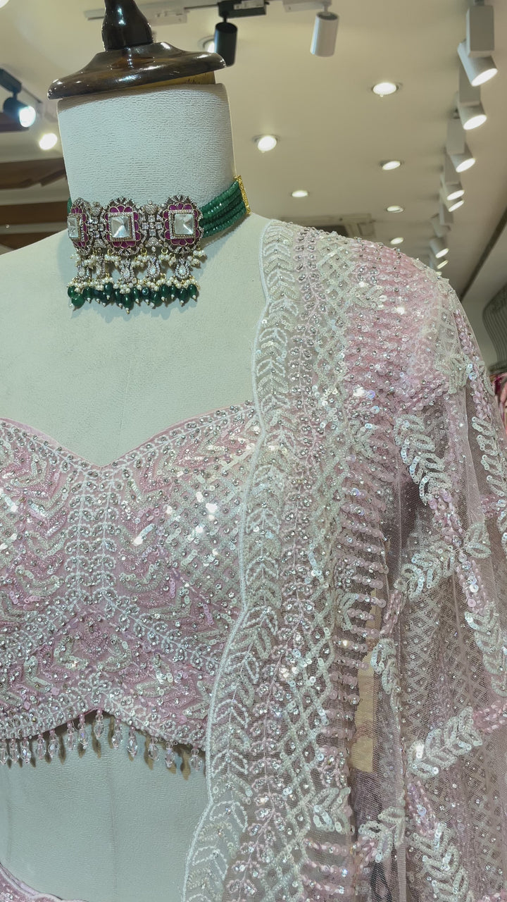 Pastel pink net lehenga with sequins and scallop dupatta