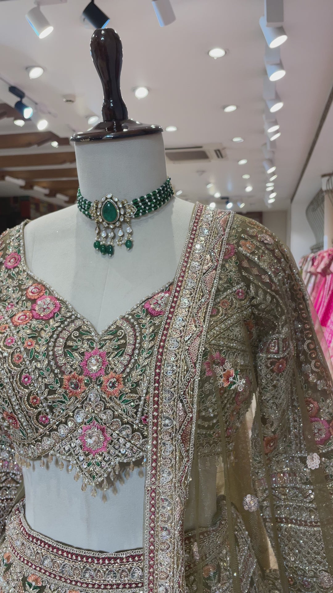 Green lehenga with multicolour threadwork and embellishments