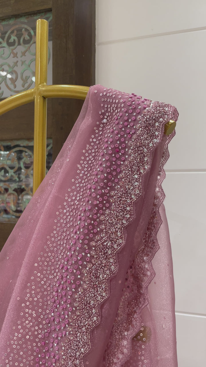 Pink tissue organza saree with sequin and cutdana embellishments