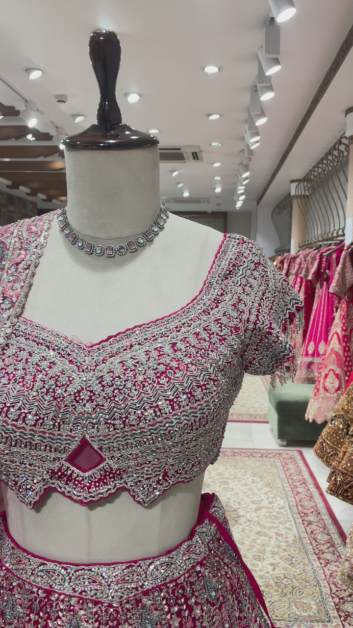 Pink net lehenga with floral motifs