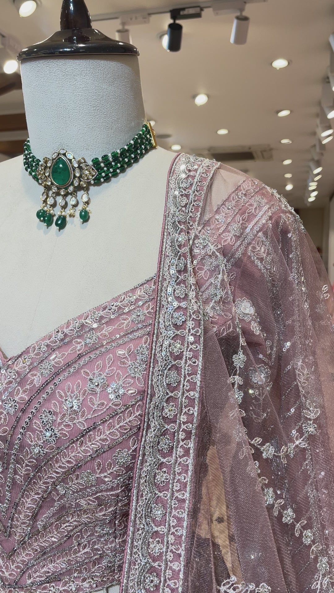 Pastel pink net lehenga with sequins and rhinestones