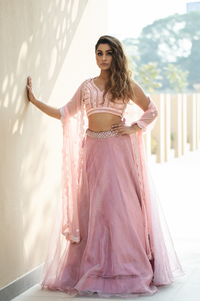 Bhasin Brothers - A Spring Soirée! Fatima is absolute magic in a peach  floral blouse with sequins lehenga paired with a chic Swarovski ruffled  stole for that perfect twirl! MUA credits Bhaavya